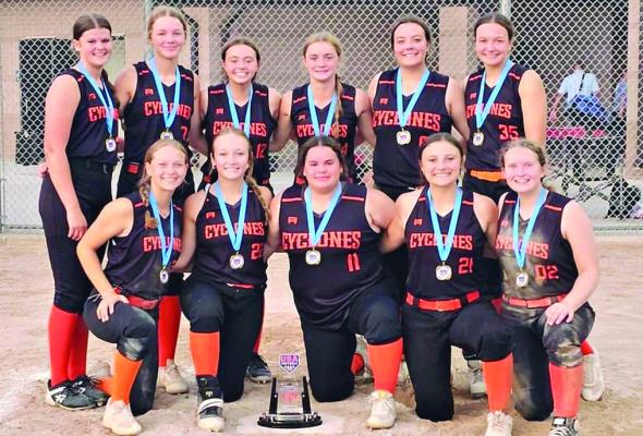 THE ES Cyclones celebrate winning the 16-and-under A Division title Sunday at the Heartland World Series. Front row, Madi Cross, Kynlee Lopez, Malaya Tedesco, Alissa Francis, Autumn Bridges; back row, Allison Hochwender, Bella Loeffert, Willa Schreier, Kamryn Florea, Keira Romazon, Josie Casler. DUSTIN DANNER | Staff