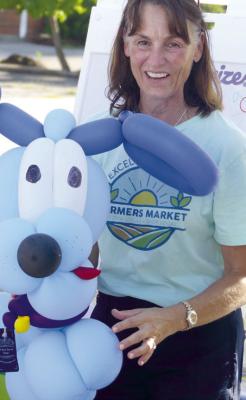 KRISTEN DEHART’S name was drawn in a raffle, allowing her to choose a prize, during last year’s National Farmers’ Market week. File photo