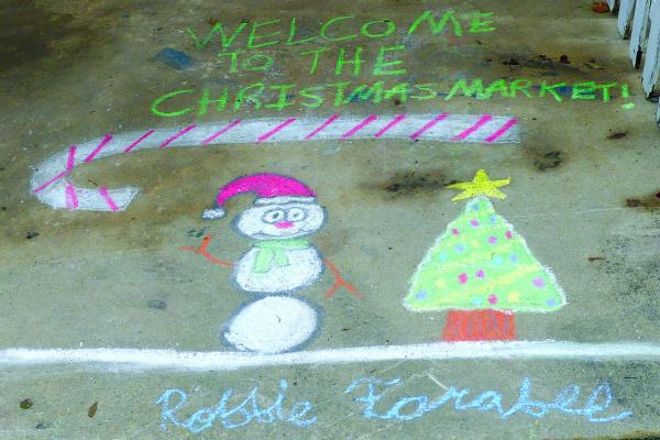 ROBBIE FARABEE kicks off the Winter Market with custom made chalk art for patrons to enjoy. ELIZABETH BARNT | Staff