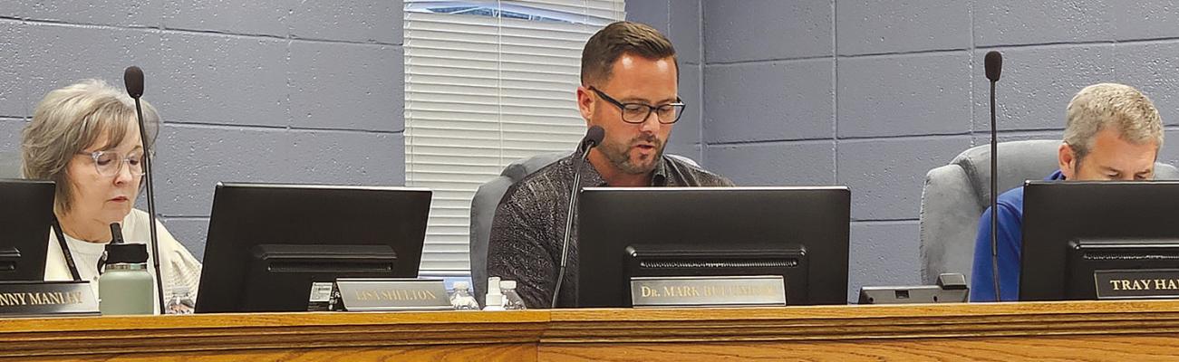 SCHOOL DISTRICT OFFICIALS discuss agenda items. MIRANDA JAMISON | Staff