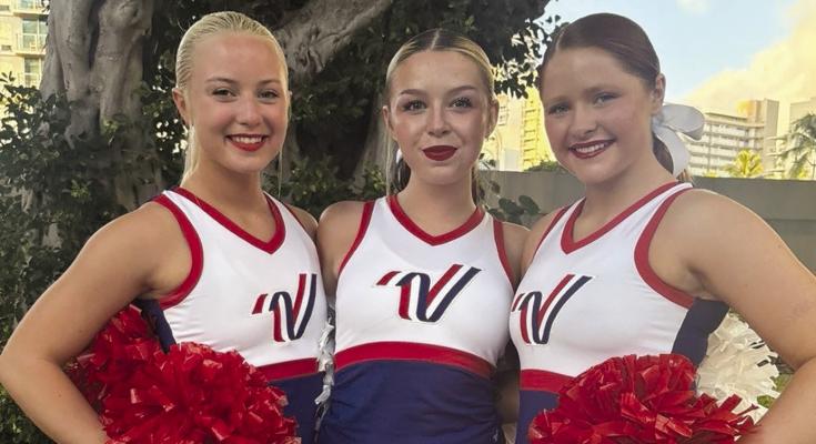 RIKKI SCHWAB (from left), Ragan Roberts and MaKenna Maring perform as Varsity Spirit All Americans during the Pearl Harbor Memorial Parade. Submitted