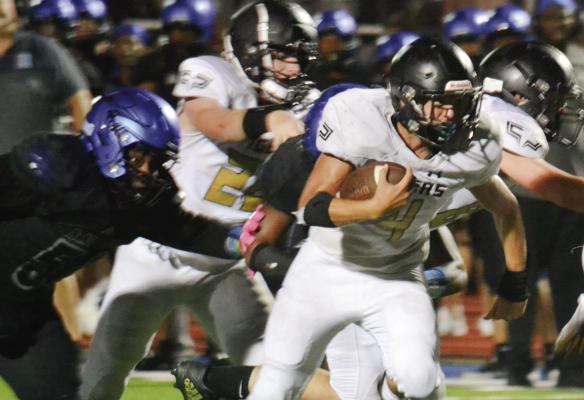 EXCELSIOR SPRINGS senior running back Rakai Gantt runs through a hole during the Tigers’ 42-21 Sept. 2 road loss to Raytown. DUSTIN DANNER | Staff
