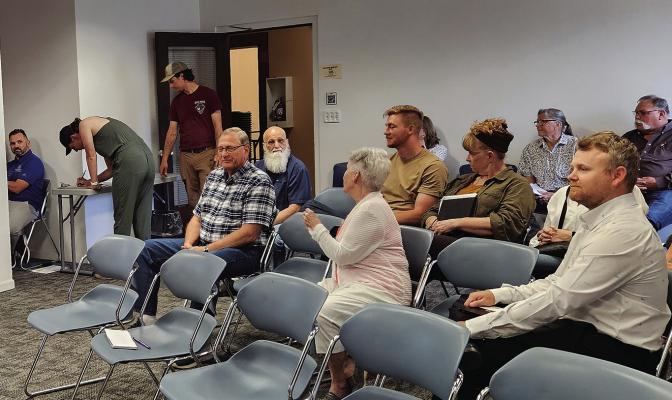 CITY COUNCIL meeting attendees wait to hear the fate of Eden Village. MIRANDA JAMISON | Staff