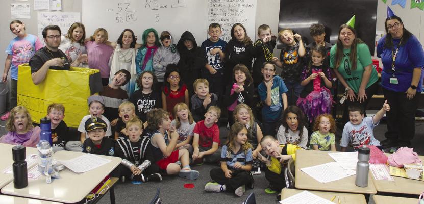 MIRANDA JAMISON | Staff LEWIS ELEMENTARY THIRD-GRADE students read their written stories to the kindergartners.