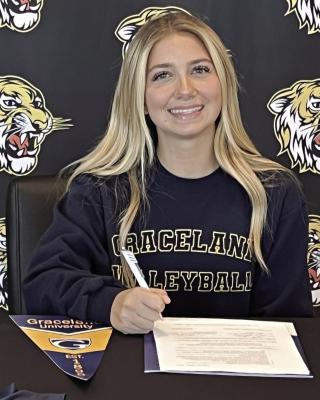 LILLAH SHUE, an Excelsior Springs senior, gets ready to sign her letter of intent to study and play volleyball for Graceland University, an NAIA-affiliated school based in Lamoni, Iowa, that has a satellite campus in Independence. Submitted