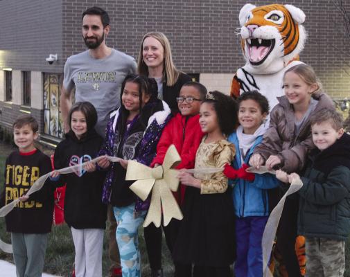 LEWIS ELEMENTARY students look forward to seeing their new school for the first time after ribbon cutting ceremonies. Students will be filling the halls on a daily basis beginning Jan. 13. SHARON DONAT | Staff