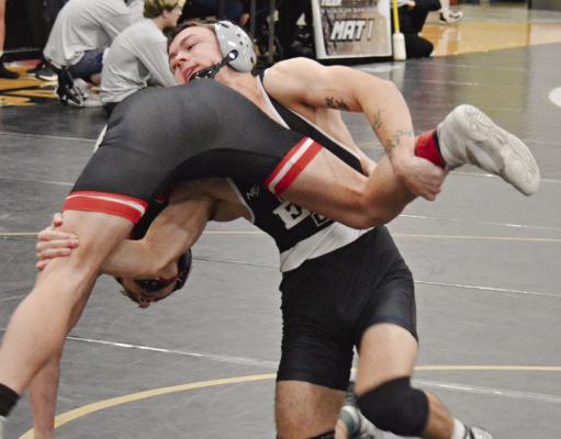SENIOR RYNE MARCUM gains inside position and prepares for a takedown in a win at the Excelsior Springs Tiger Classic. DUSTIN DANNER | Staff