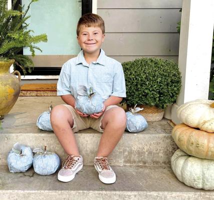 GRAYSON GROSSO, 9, shows off a teal pumpkin and the new message for candy-filled holidays. His mother, Sara Grosso, is an advocate for the project. (Submitted by Sara Grosso)