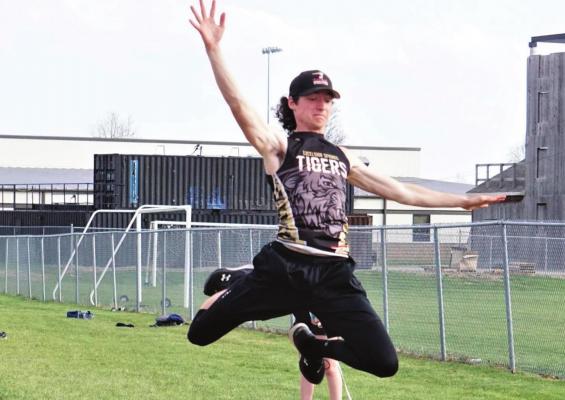 JUNIOR DALTON LAYTON attempts the long jump during the Mineral Water Classic April 22 at Tiger Stadium. DUSTIN DANNER | Staff