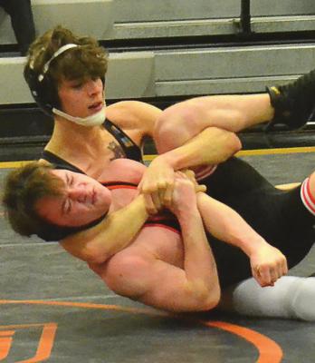 EXCELSIOR SPRINGS sophomore Micah Danner secures a cradle and win last week at the Platte County Invitational. DUSTIN DANNER | Staff