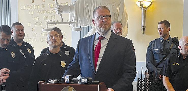 CLAY COUNTY PROSECUTING Attorney Zach Thompson (center), accompanied by various local law enforcement officials, announces a new “No Refusal” policy during a recent press conference. The new policy was established to combat the serious problems associated with driving under the influence. MIRANDA JAMISON | Staff