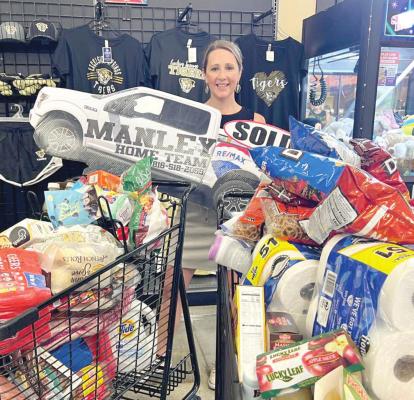 CHRISTEN EVERETT was selected July 9 to run through the aisles of Price Chopper and grab as many groceries as possible.
