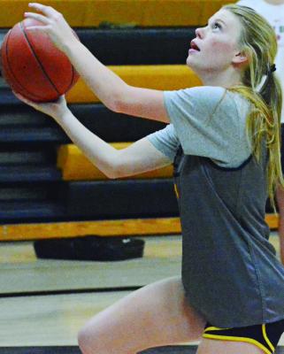 ORRICK JUNIOR Addison Chapman goes for a layup during a preseason practice in her high school gym. Chapman and her teammates have kicked off their varsity girls basketball season, downing Northwestern of Mendon 29-20 recently at Orrick in a varsity girls-boys doubleheader. Orrick was scheduled for a Tuesday home girls-boys doubleheader with Polo. SHAWN RONEY | Staff