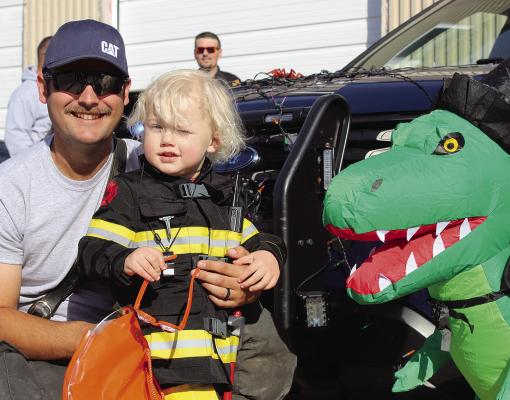 LIAM JOHNSON (right) dresses like his uncle, Kody Gaines, during trunk or treat festivities. SHARON DONAT | Staff