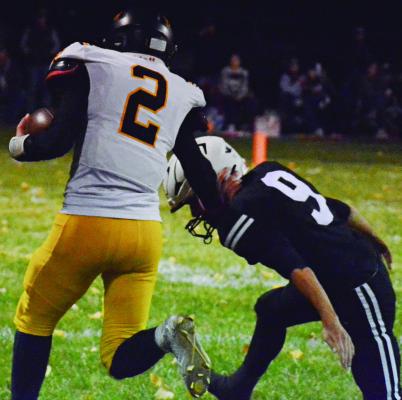 ORRICK JUNIOR Gage Tebbe (left) stiff-arms Norborne Hardin-Central’s Brody Fifer during the first quarter of district play in 8-man football. Orrick lost 54-16. The Bearcats finished 3-8. SHAWN RONEY | Staff