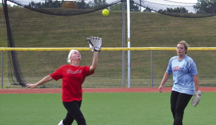 EXCELSIOR SPRINGS sophomore Alyssa Dean gets under a fly ball and gets some practice reps in the outfield.