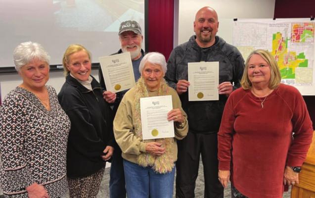 THE BALLINGER FAMILY, left, has their ice cream stand, Dari-B, recognized Monday at the Excelsior Springs City Council meeting by Mayor Sharon Powell, right, who declares March Dari-B Month.
