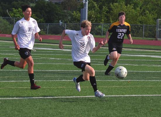 FRESHMAN KOLLIN KINCAID looks to break away from Kearney defenders for Excelsior Springs. DUSTIN DANNER | Staff