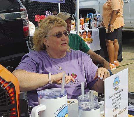 TAMMY MURPHY talks with shoppers during this year’s opening day of the Excelsior Springs Farmers Market. MIRANDA JAMISON | Staff