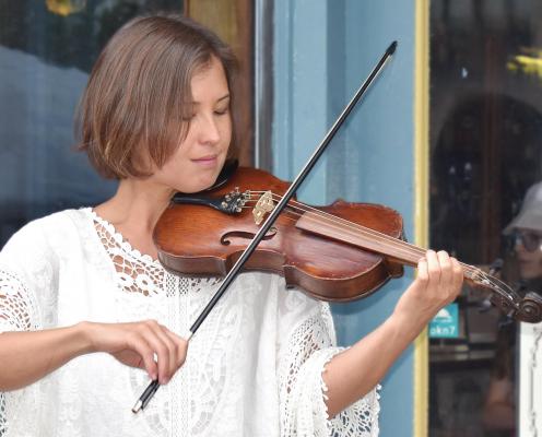 COLEEN DIEKER, a Kansas City native, plays some Scots-Irish tunes on a 1936 fiddle during the Clay County Bicentennial. The fiddle was built from wood salvaged from the second Clay County Courthouse, razed in 1934. BRIAN RICE | Staff