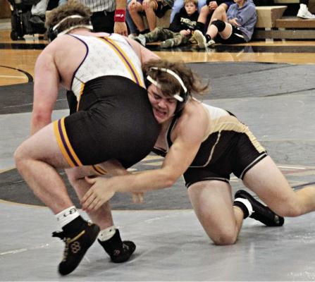 EXCELSIOR SPRINGS JUNIOR Lane Crowley, right, reaches for a single leg during his 215-pound match with Jase Jackson as the Tigers face Kearney in a Jan. 11 home dual. DUSTIN DANNER | Staff