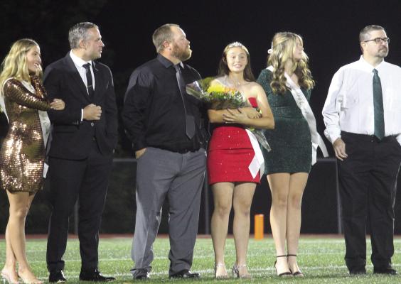 MIRANDA JAMISON | Staff EXCELSIOR HIGH Springs Sophomore Princess Willa Schreier (left) with her escort Chris Scherier during the halftime.