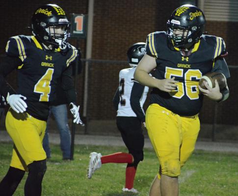 ORRICK JUNIOR Reese McCartney (left) gives a look to teammate Levi Fielder after catching a two-point conversion pass late in the Bearcats’ district victory over Northland Christian. SHAWN RONEY | Staff