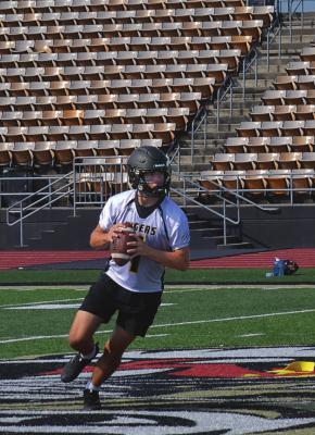 QUARTERBACK CHANCE MORELAND rolls out to pass Monday.