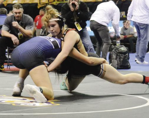 EXCELSIOR SPRINGS senior Vada Burton, right, grapples during the Class 1 state girls tournament, held Feb. 22-23 at Mizzou Arena in Columbia. DUSTIN DANNER | Staff