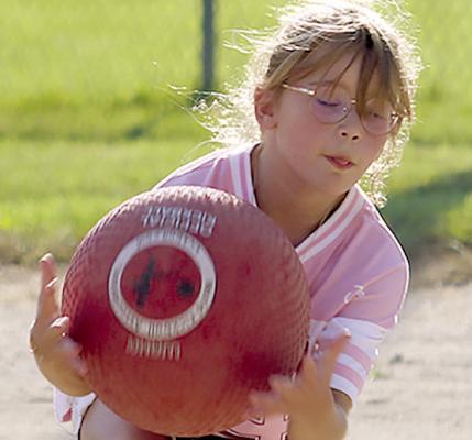 ISLA BRYAN makes a catch during Family Kickball Night.