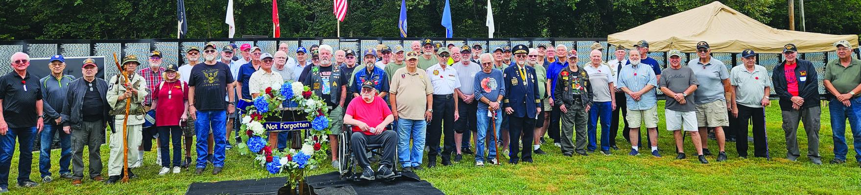 LOCAL AND VISITING veterans come together in front of the Vietnam Traveling Memorial Wall. MIRANDA JAMISON | Staff