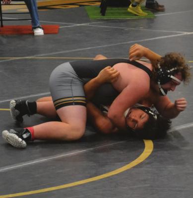 JUNIOR JB PRESTIA puts his opponent on his back to seal a win by fall during the Tiger Classic last weekend at Excelsior Springs High School. DUSTIN DANNER | Staff