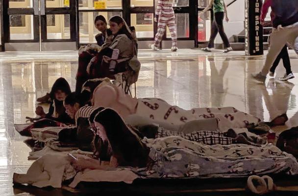 ATTENDEES RELAX on blankets across the commons floor while watching The Grinch. MIRANDA JAMISON | Staff