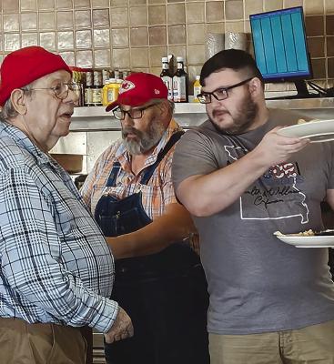 CLAY MASONIC LODGE Past Master Dennis Farabee (from left), Worshipful Master Troy Mull and Senior Warden serve breakfast to attendees at Flapjacks with Santa.