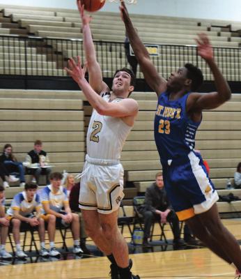 SENIOR GANNON WILLIS goes for a layup, and two points, during the Tigers’ Jan. 7 home loss to St. Pius X of Kansas City. DUSTIN DANNER | Staff