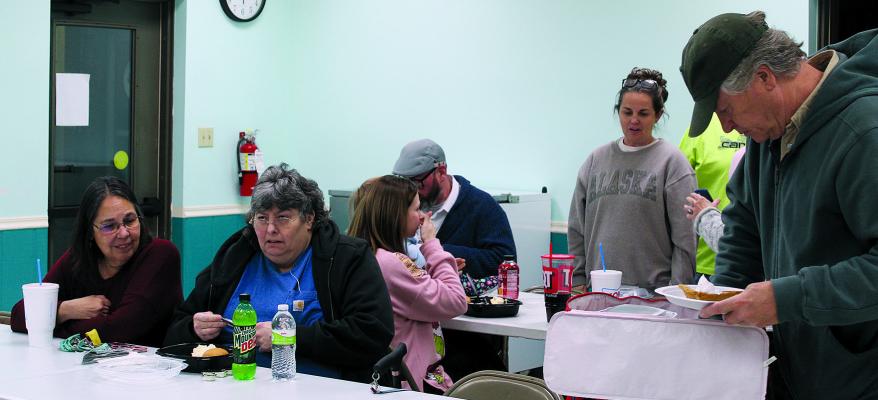 MISSOURI CITY families share food and conversation during the Clay County Sheriff’s Office holiday meal outreach event. MIRANDA JAMISON | Staff
