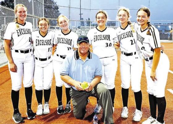LONGTIME SOFTBALL UMPIRE Mike Karl (center), shown with some Excelsior Springs High School players, is an excellent ambassador for the sport he officiates and a source of inspiration. SUBMITTED PHOTO