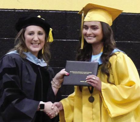 DR. CHRISTEN EVERETT rewards Rachel Davis with a hand shake and her diploma during Richmond High School’s graduation ceremony. See Pages 6 and 7 for more. ELIZABETH BARNT | Staff