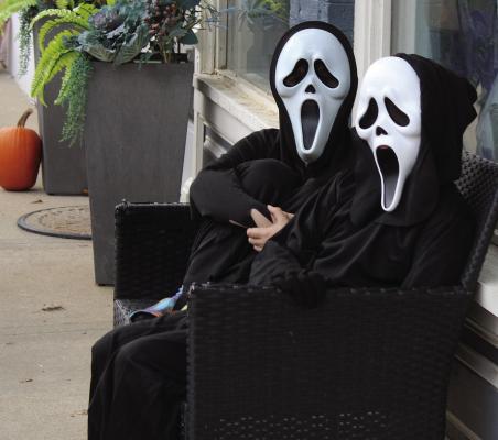 TWO GHOSTFACE participants pretend to scare attendees who pass by. MIRANDA JAMISON | Staff