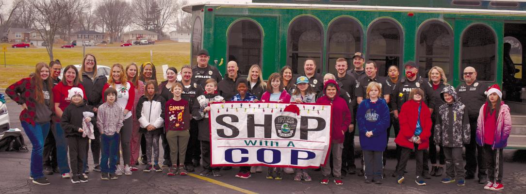 EXCELSIOR SPRINGS LAW ENFORCEMENT takes 13 children to shop for holiday gifts. The children ride to Walmart in a trolley, which is police-escorted with lights and sirens. TARA ALTIS | Staff