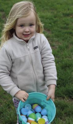 MIRANDA JAMISON | Staff HARPER MCCURLEY shows off her collected eggs.