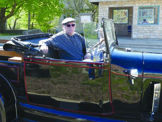 Micheal Owen drives around in his 1928 open cab pickup.
