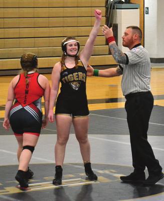 EXCELSIOR SPRINGS senior Sierra Stodden gets her hand raised in victory in her first match after returning from an injury. DUSTIN DANNER | Staff