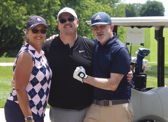 EXCELSIOR SPRINGS HIGH SCHOOL volleyball coach Terri Irons (from left), Michael Cox and Dean Woods get ready to take their swings on the golf course. MIRANDA JAMISON | Staff