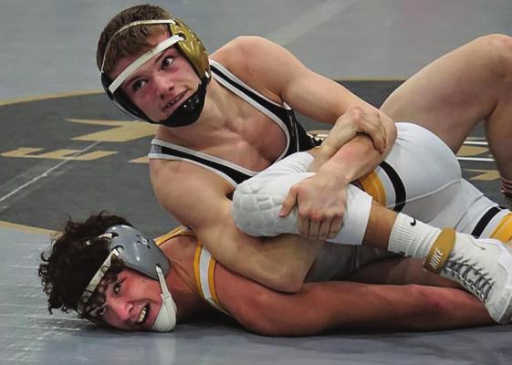 JUNIOR LANDEN DAVIS gains control on his way to the 126-pound title Feb. 27 at the Class Sectional 4 Tournament at Excelsior Springs High School. TIM HARLAN | Submitted Photo