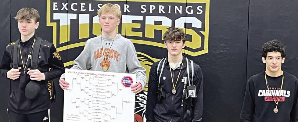 FRESHMAN LOGAN BATES (third from left) placed third at 113 pounds. Submitted