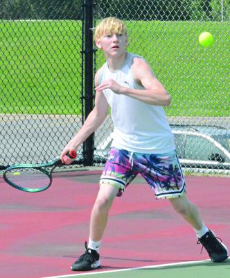 NOAH DUNKER is set to hit a forehand shot while playing a match of singles tennis during a recent camp for Excelsior Springs students in grades K-12. Dunker, an underclassman at Excelsior Springs High School, was the No. 5 singles player this spring on the school’s varsity tennis squad. He’s part of a nucleus of players expected to return next season.
