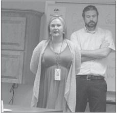 RACHEL GABRIEL (left) and Taylor Freburg talk to the SAFE coalition about Synergy Services in school.