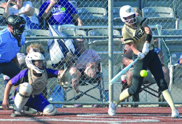 REESE RYAN (right) takes a swing during Excelsior Springs’ varsity softball game with South Harrison. SHAWN RONEY | Staff