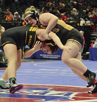 ADRIEN CRAWLEY (right) gains control and prepares for a takedown during a wrestleback match last week at Class 1 state competition in Columbia. DUSTIN DANNER | Staff
